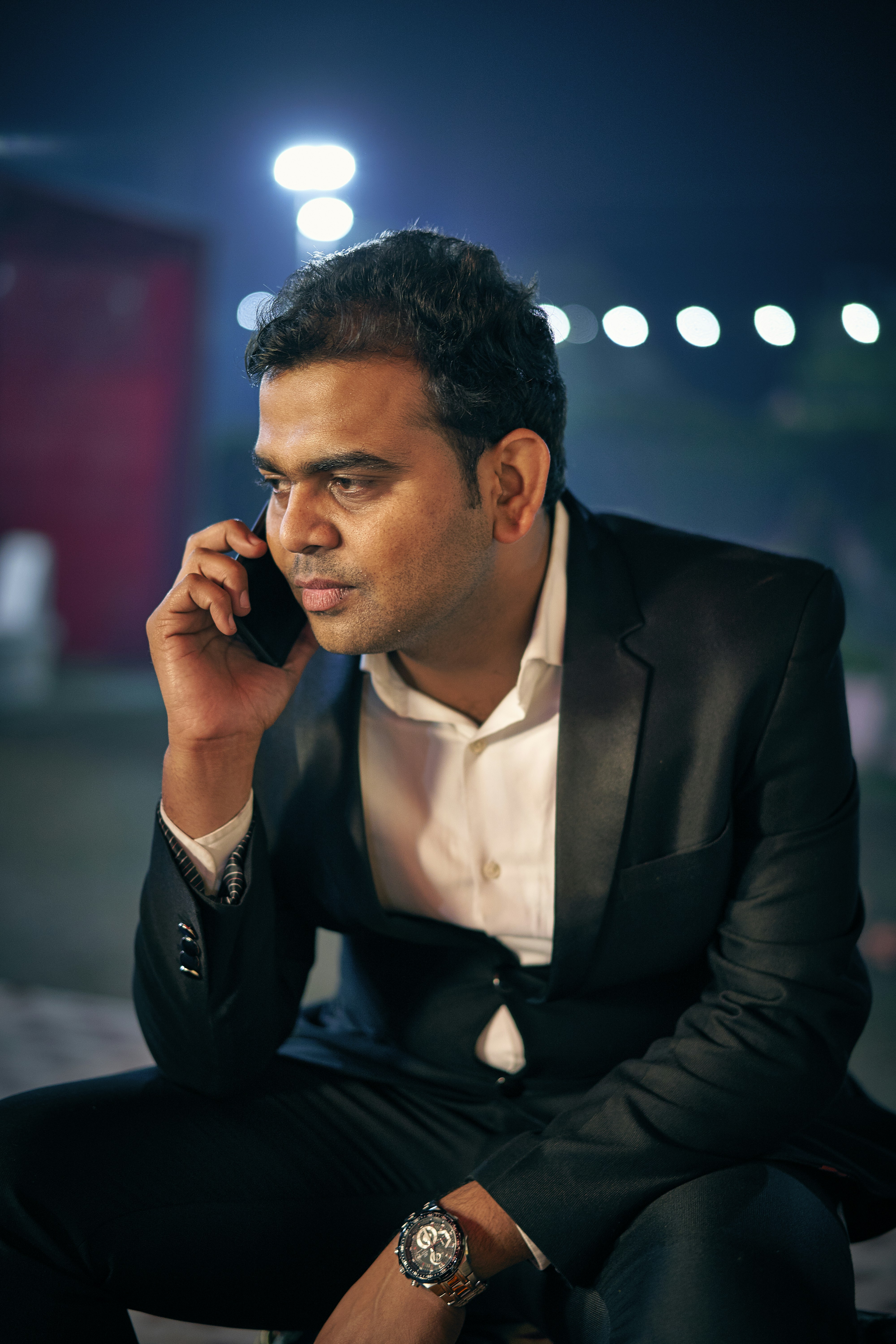 selective focus photography of man talking on phone