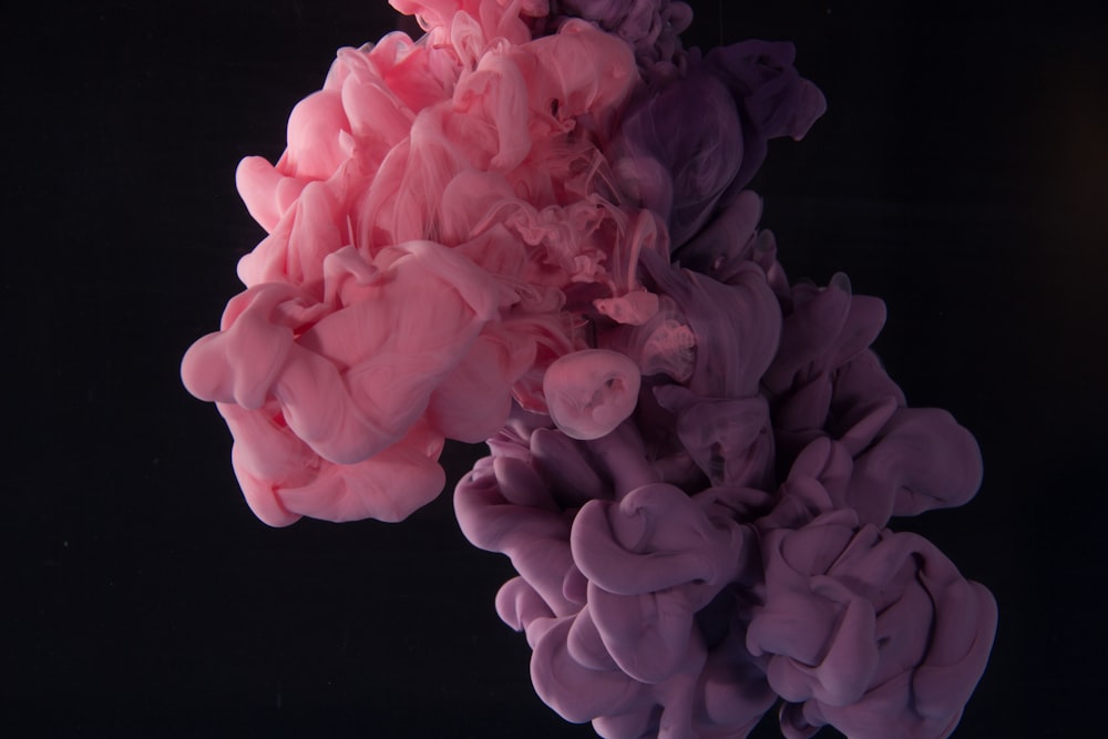 pink smoke with black background