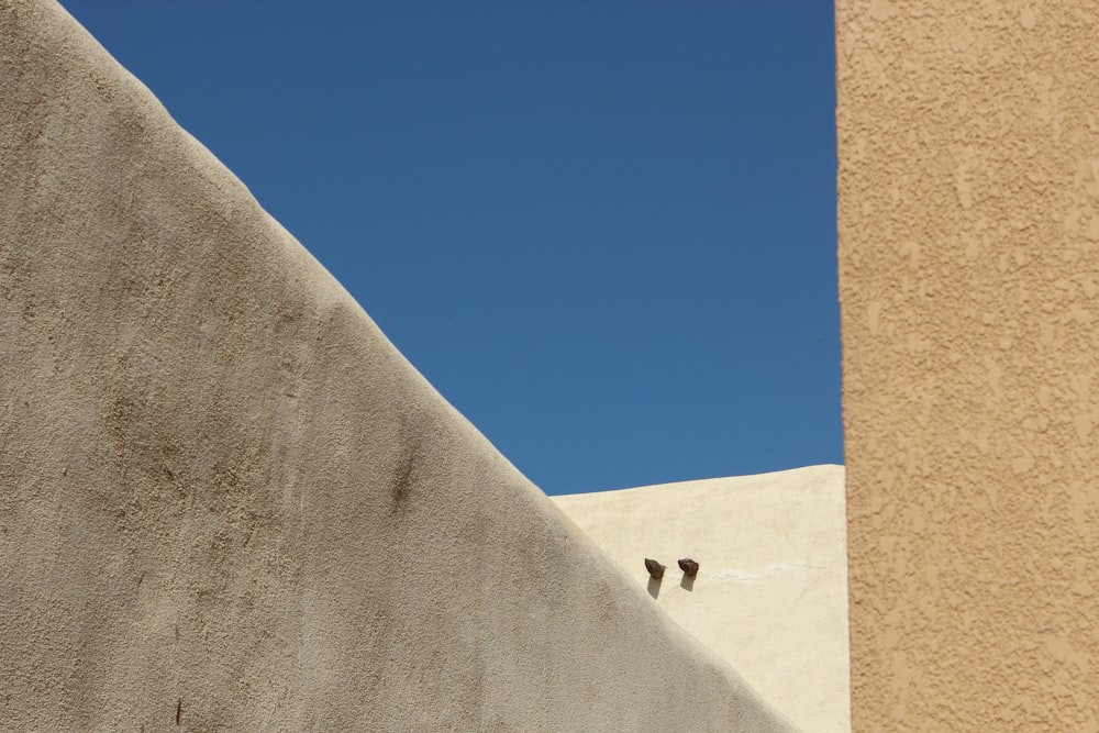 low-angle photography of brown concrete structures