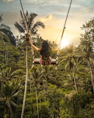 woman sitting on swing bench