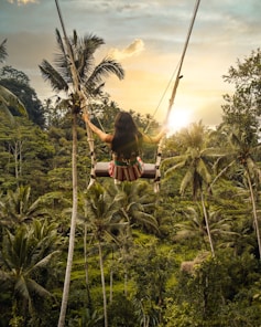 woman sitting on swing bench