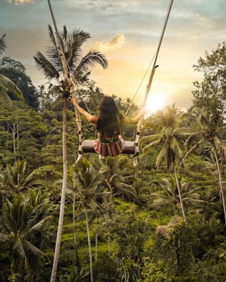 woman sitting on swing bench