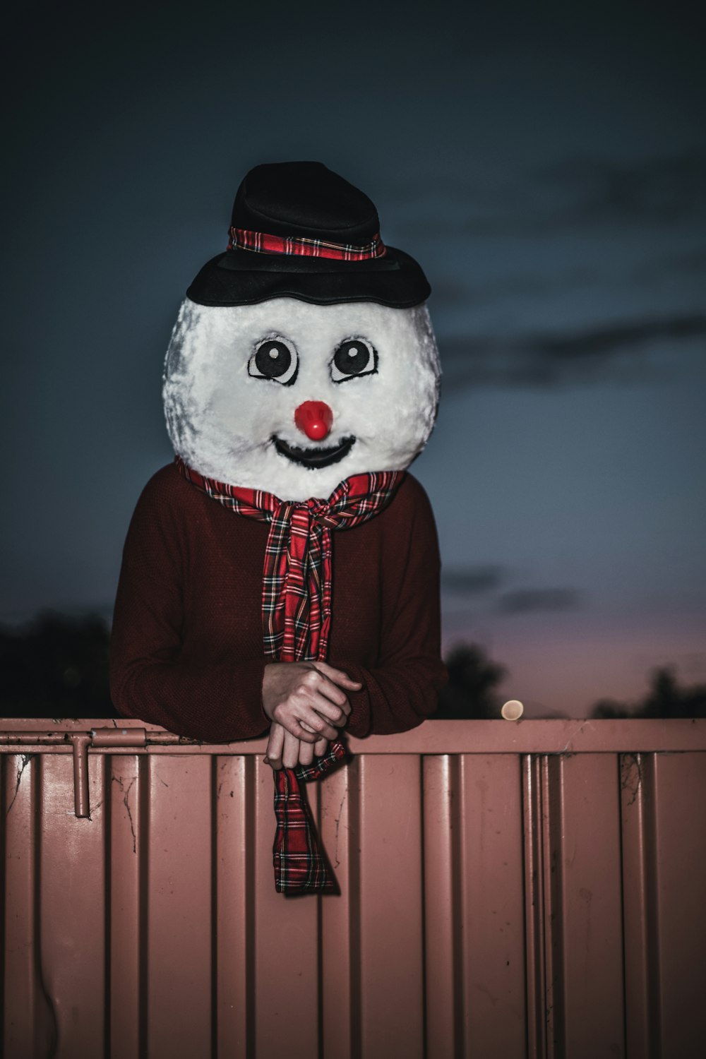 person wearing snowman mascot