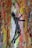 A textured abstract painting featuring a silhouette of a person with outstretched arms against a vibrant background. The energetic brushstrokes and mix of colors create a dynamic composition.