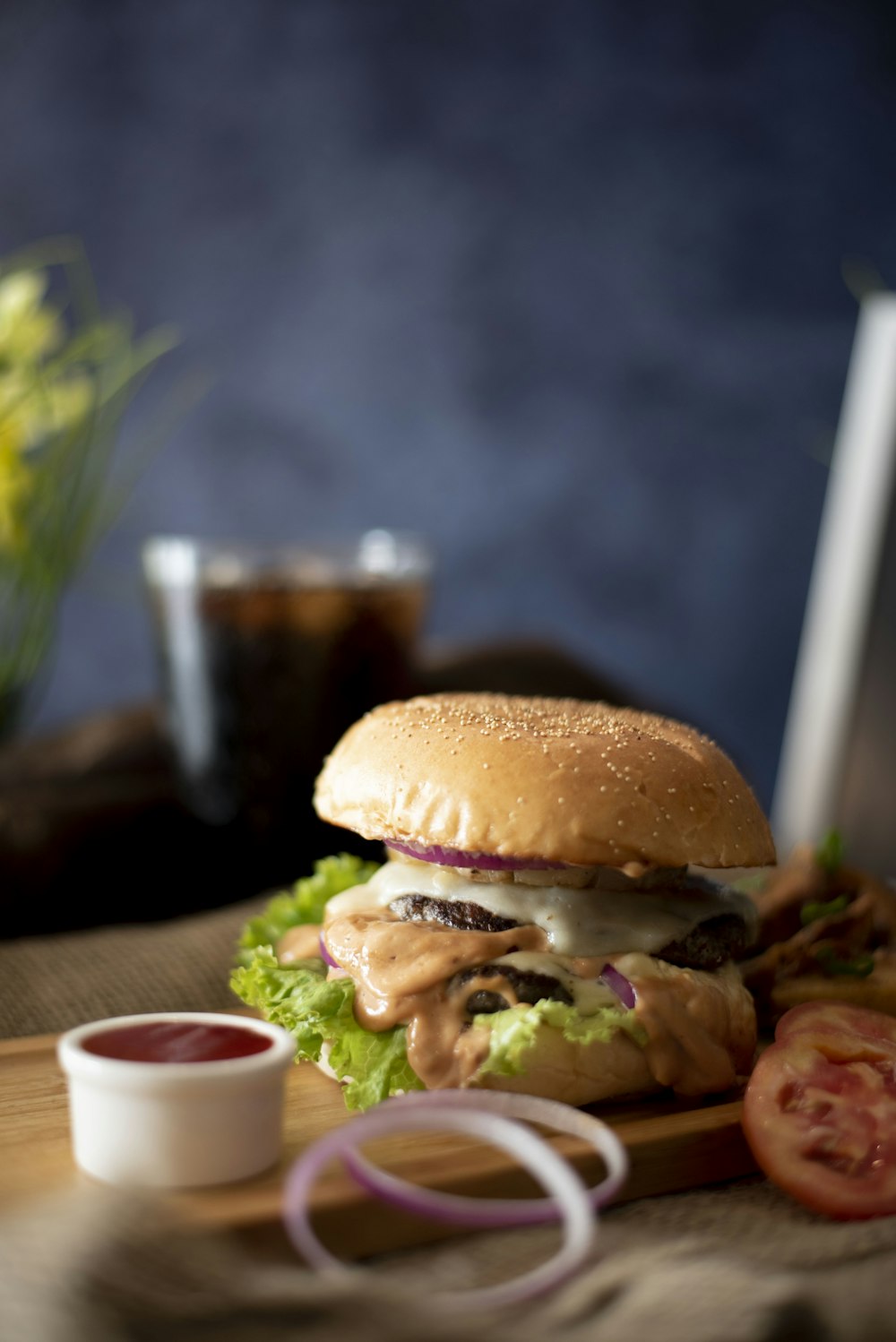 burger dish on brown copping board