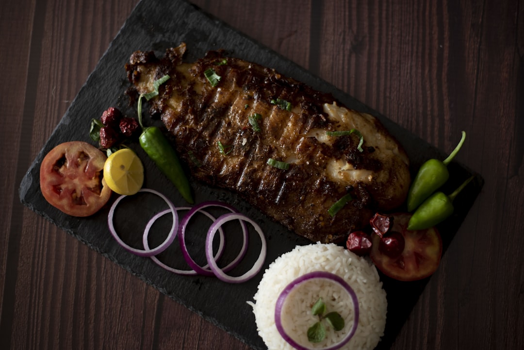 cooked food with rice and onions, Tawa Fish with White Rice