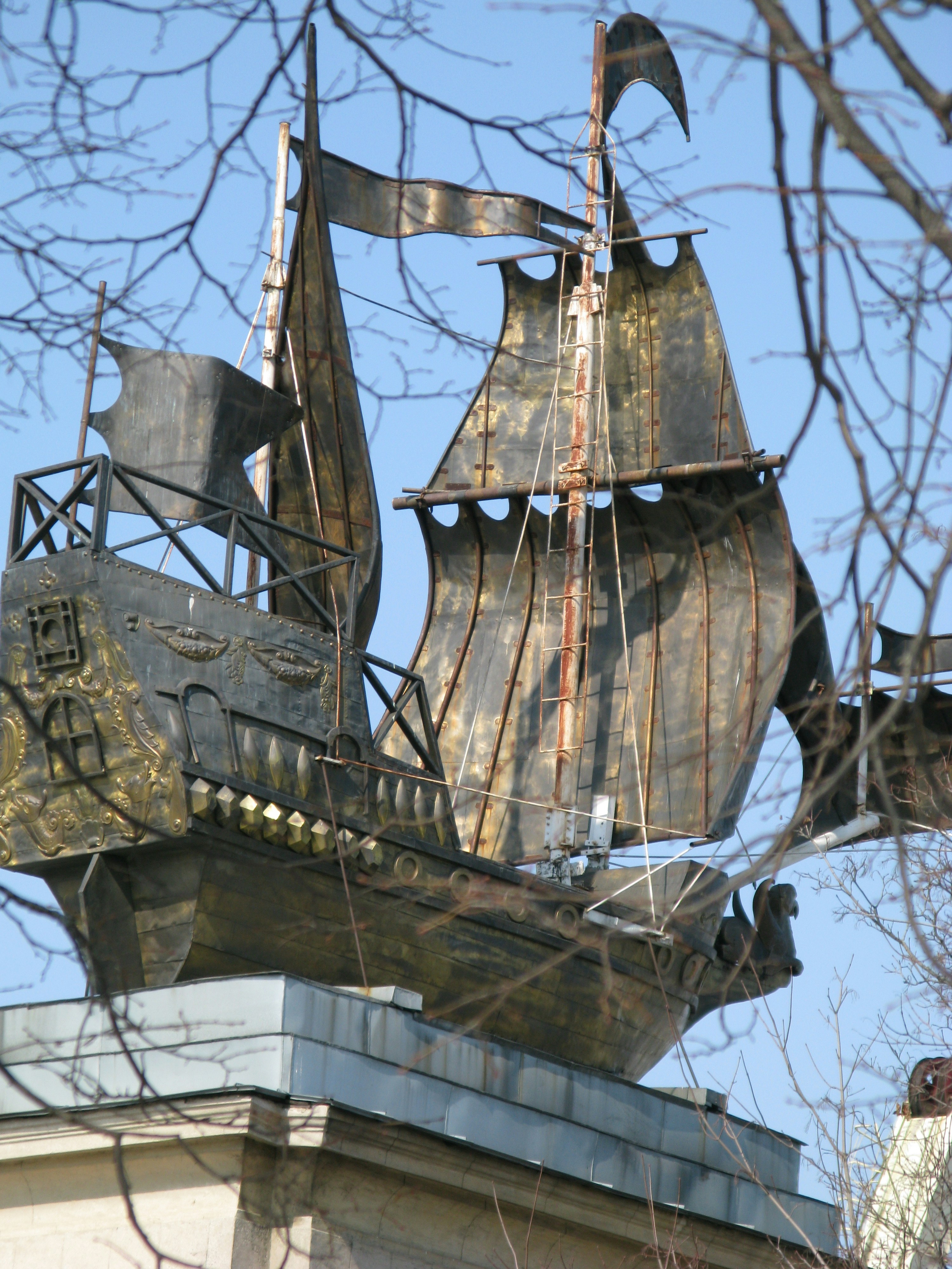 gray wooden sailing boat figurine