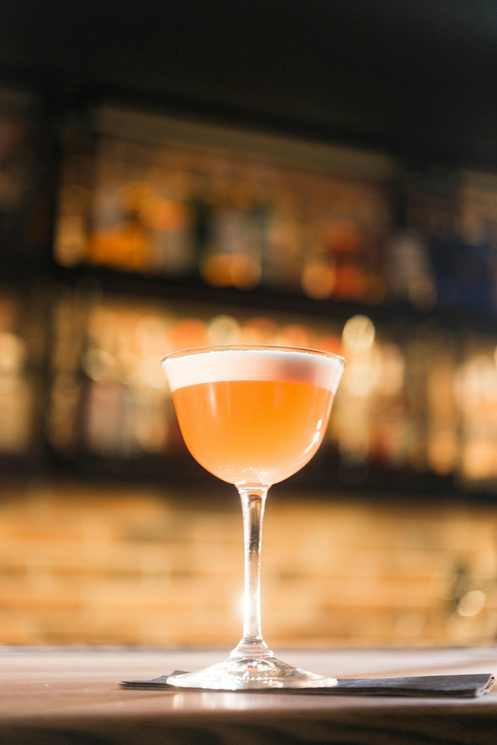 glass of orange cocktail
