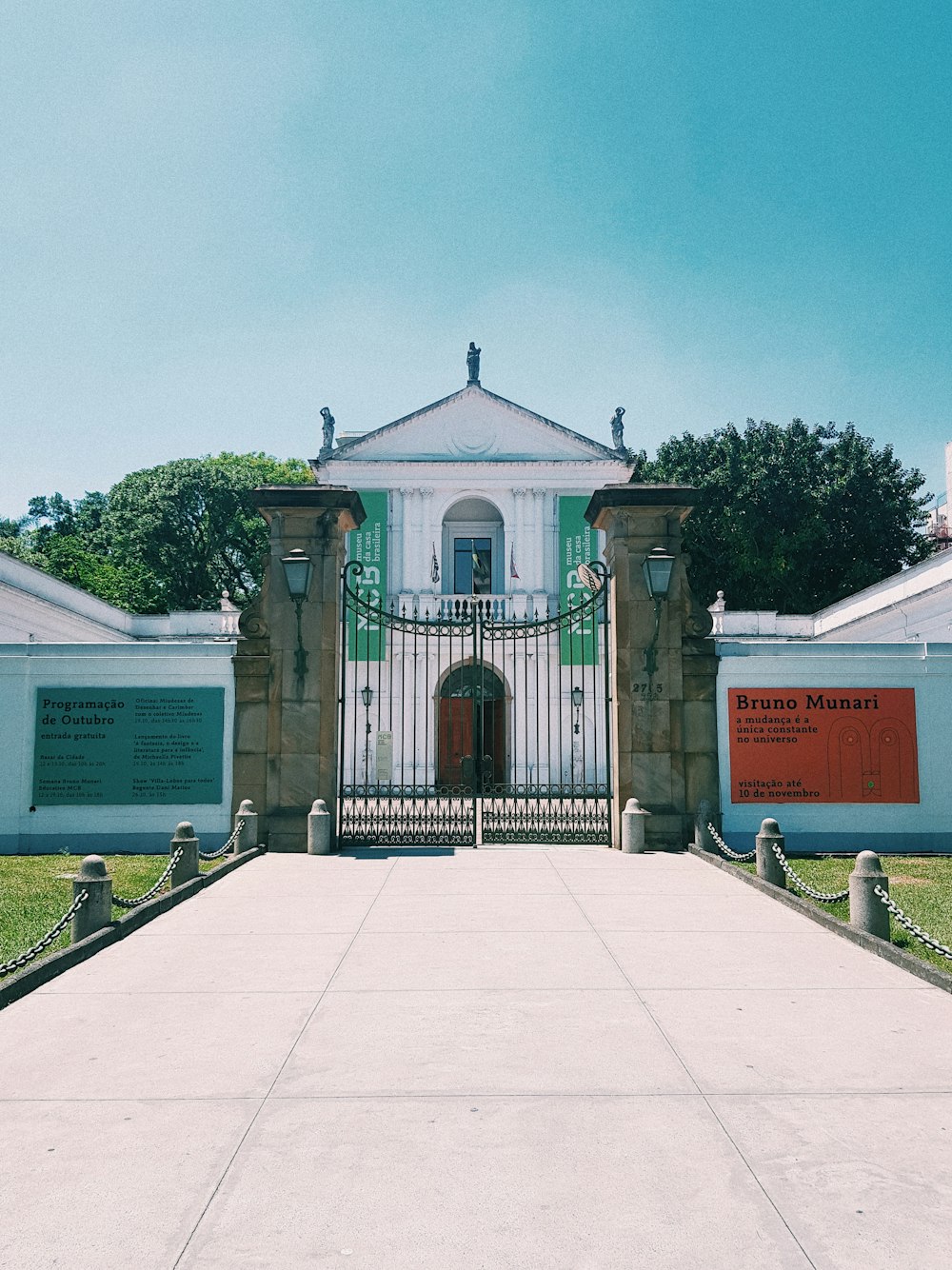 white and green mausoleum near trees