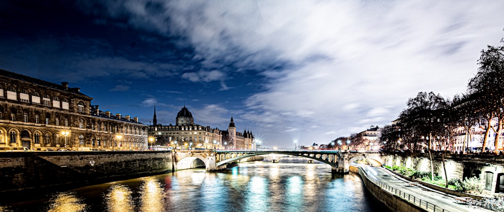 bridge near city under white sky