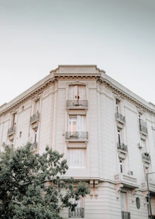 Wide shot of Casa Serenă’s elegant facade in Călărași against a clear blue sky.