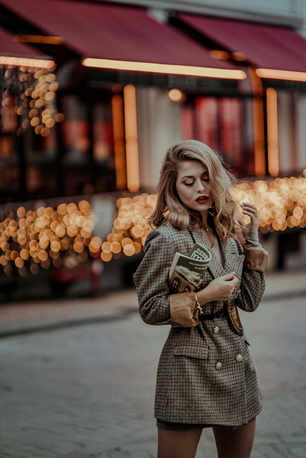 woman standing on sidewalk