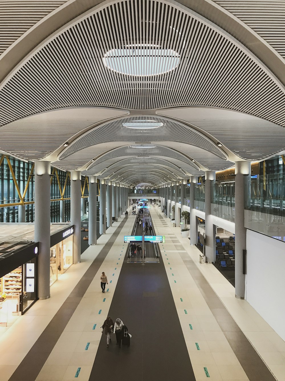 photography of people walking on walkway