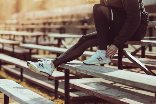 injured runner sitting on bleachers