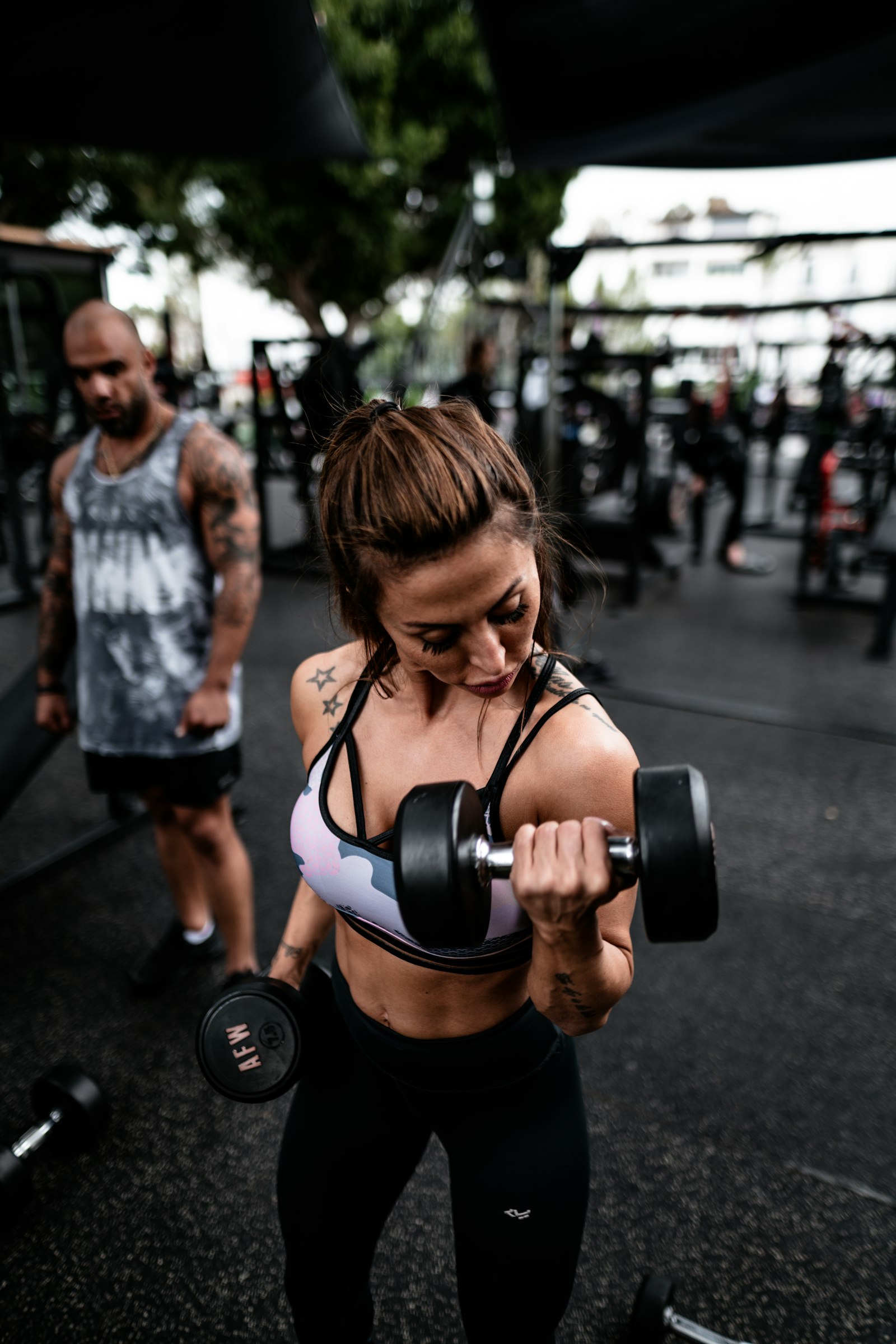 Sony a7R II + Sigma 24mm F1.4 DG HSM Art sample photo. Woman lifting dumbbell photography