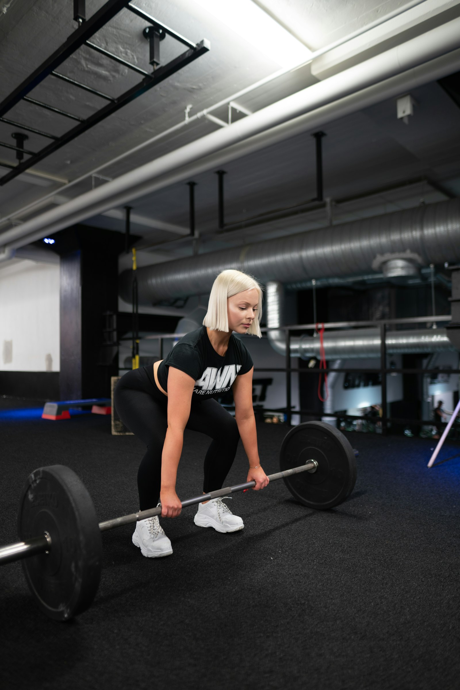 Sony a7R II + Sigma 24mm F1.4 DG HSM Art sample photo. Woman holding barbell photography