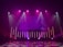 A dimly lit stage features vibrant purple and pink lighting emanating from spotlights and LED bars. The backdrop displays abstract patterns, while the floor reflects circular and linear light patterns, creating an energetic and dynamic visual atmosphere.