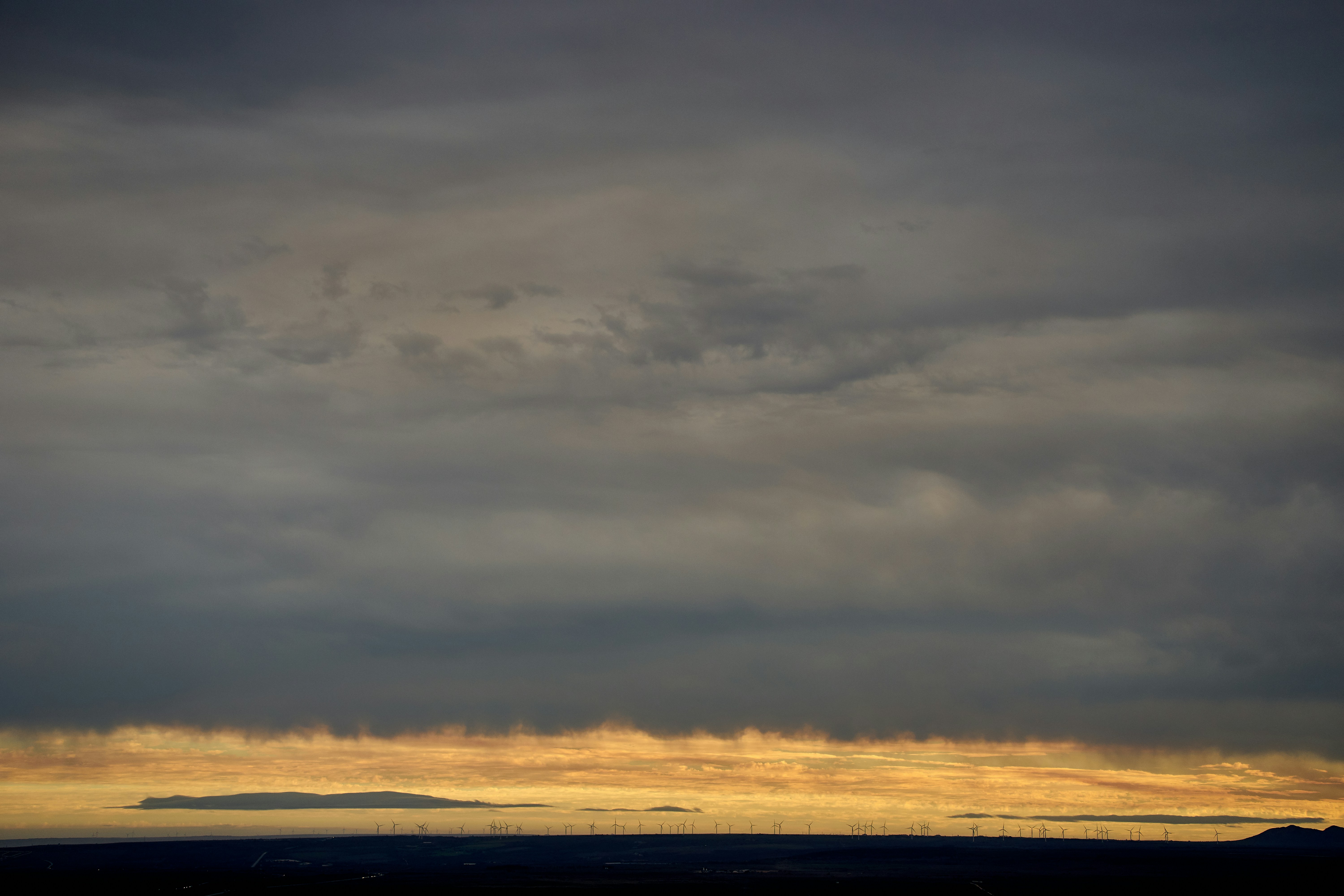 View from the game farm in the direction of Jeffreys bay The clouds look like island levitate above windmills