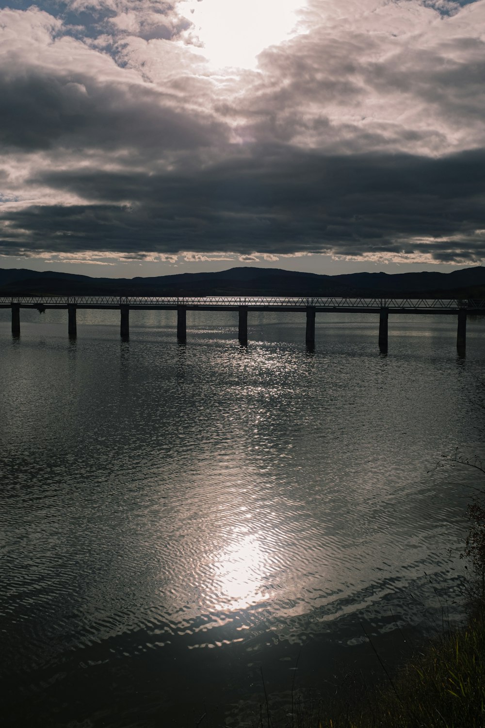 body of water under cloudy sky during daytime