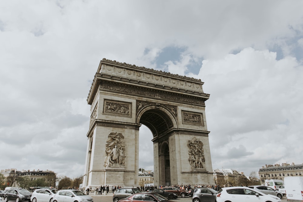 people and cars at Arc de Triomphe Paris, France during day