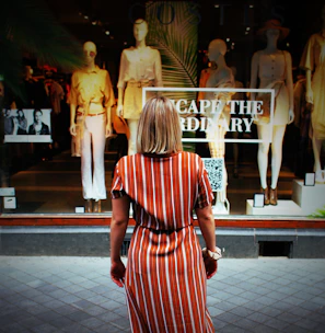 woman in front of clothes store
