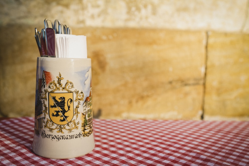 pens in cup on table