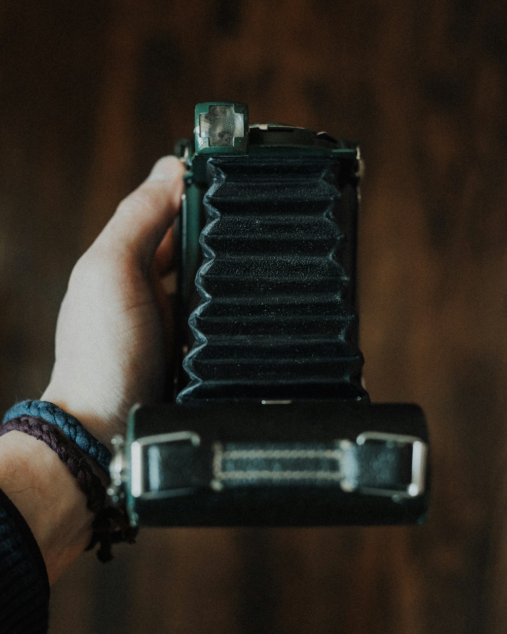 person holding land camera