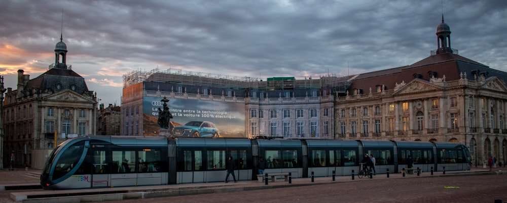 train near building during day