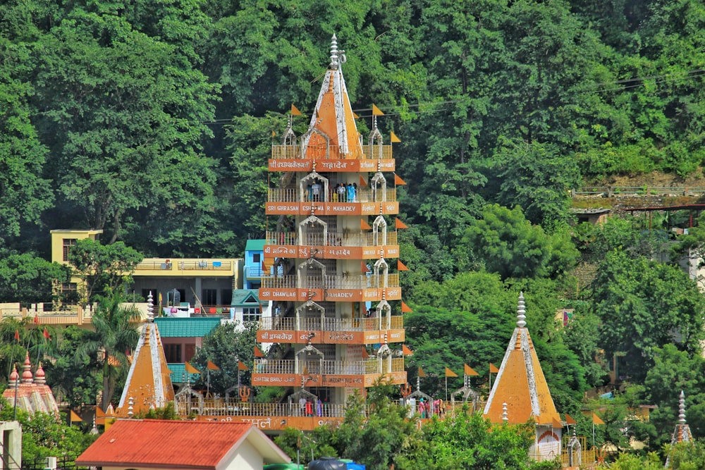 brown tower beside trees