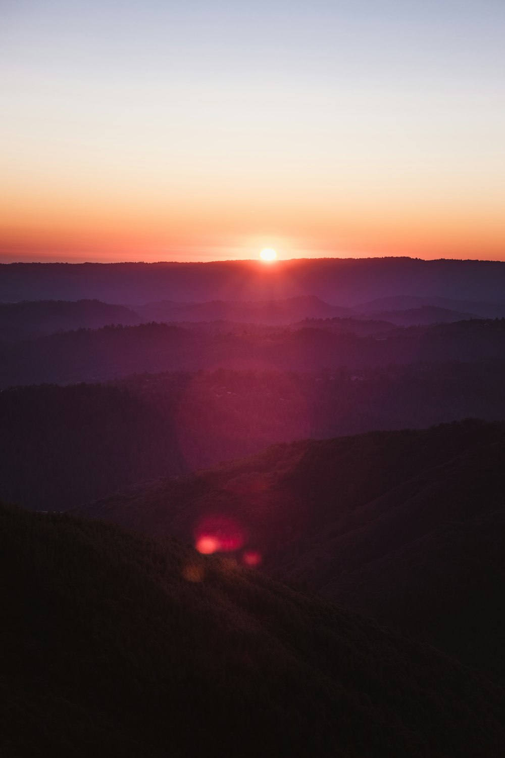 aerial photograph of mountain ranges during sunrise