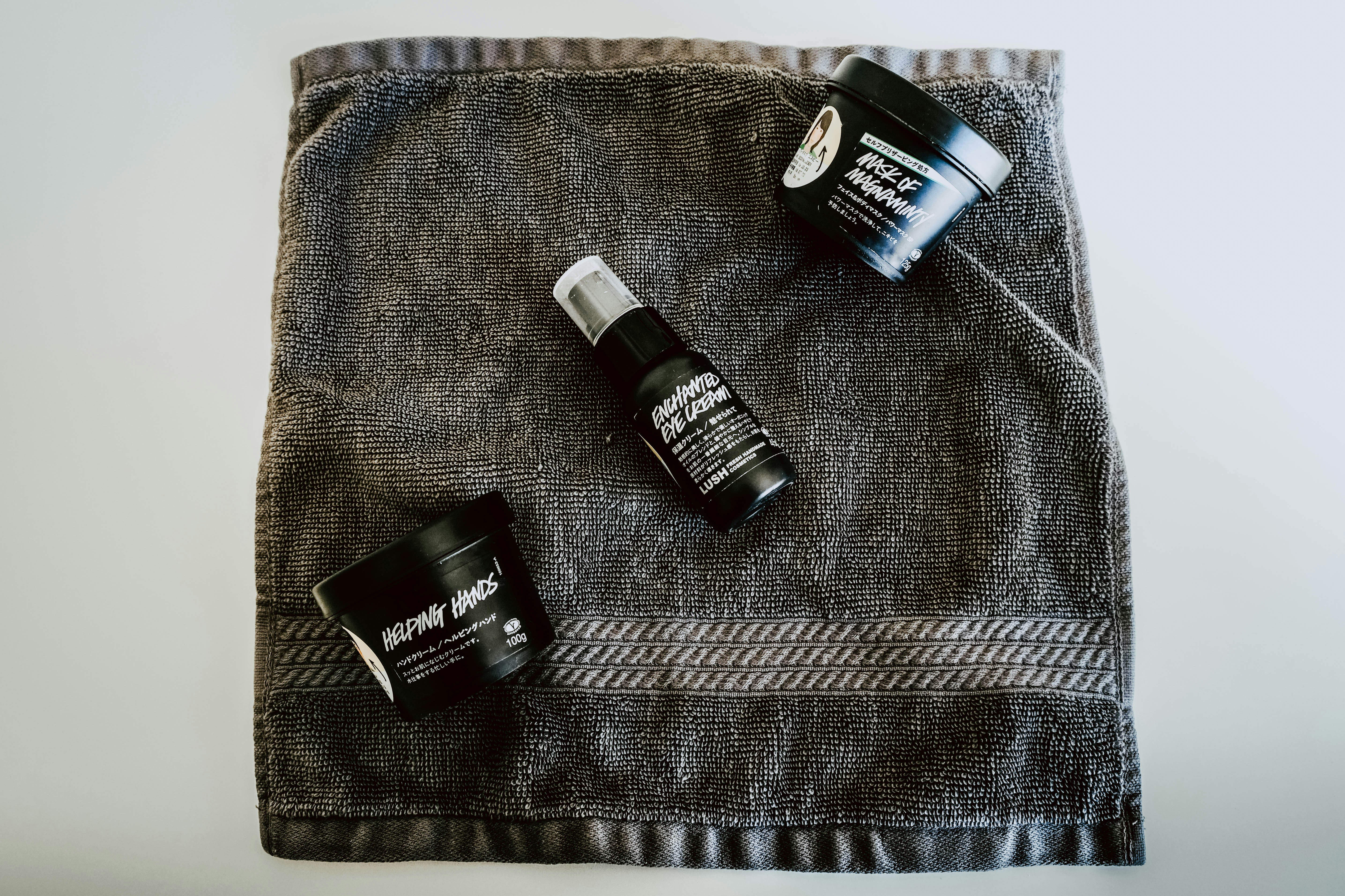 black plastic bottle and two canisters