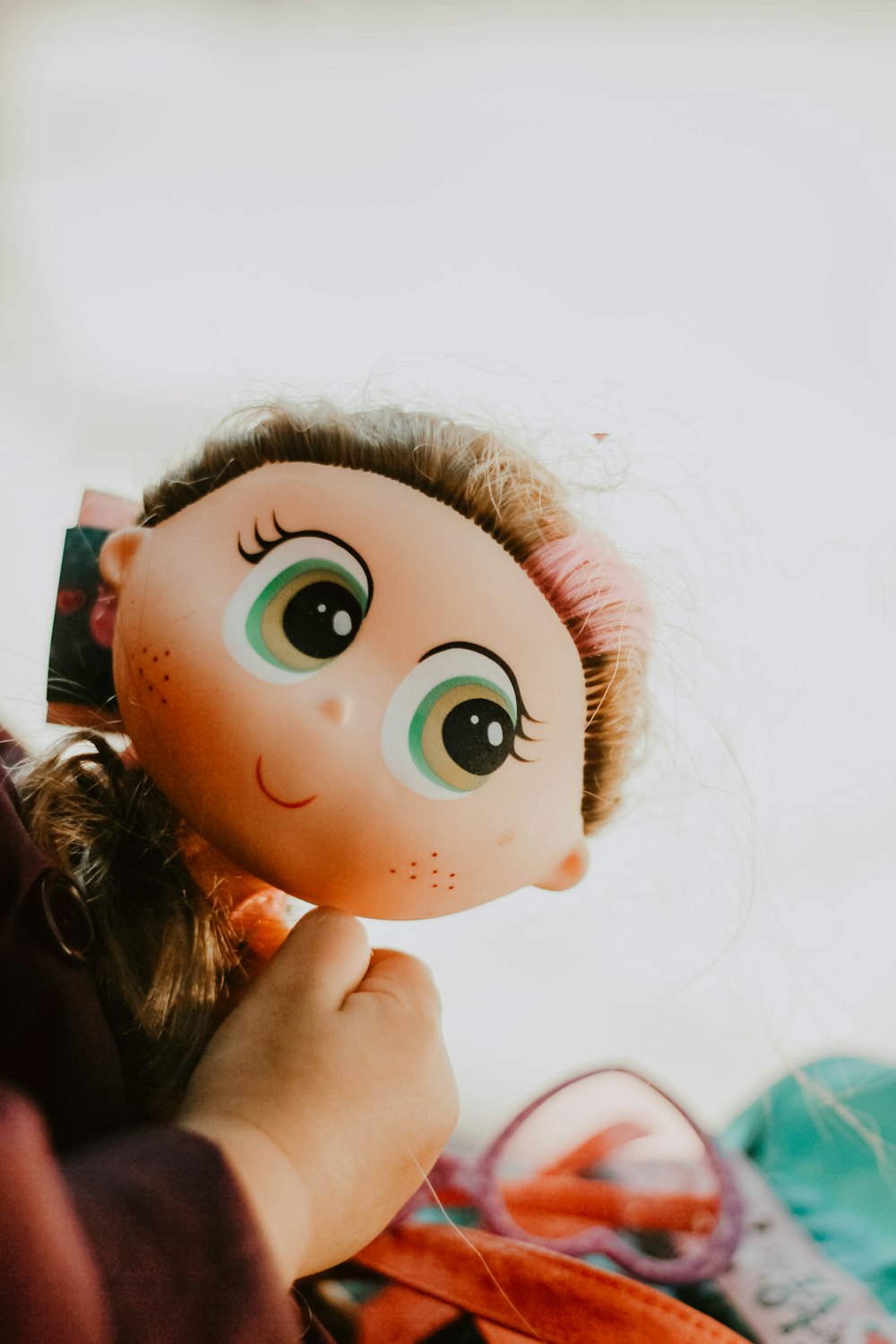 baby holding female doll