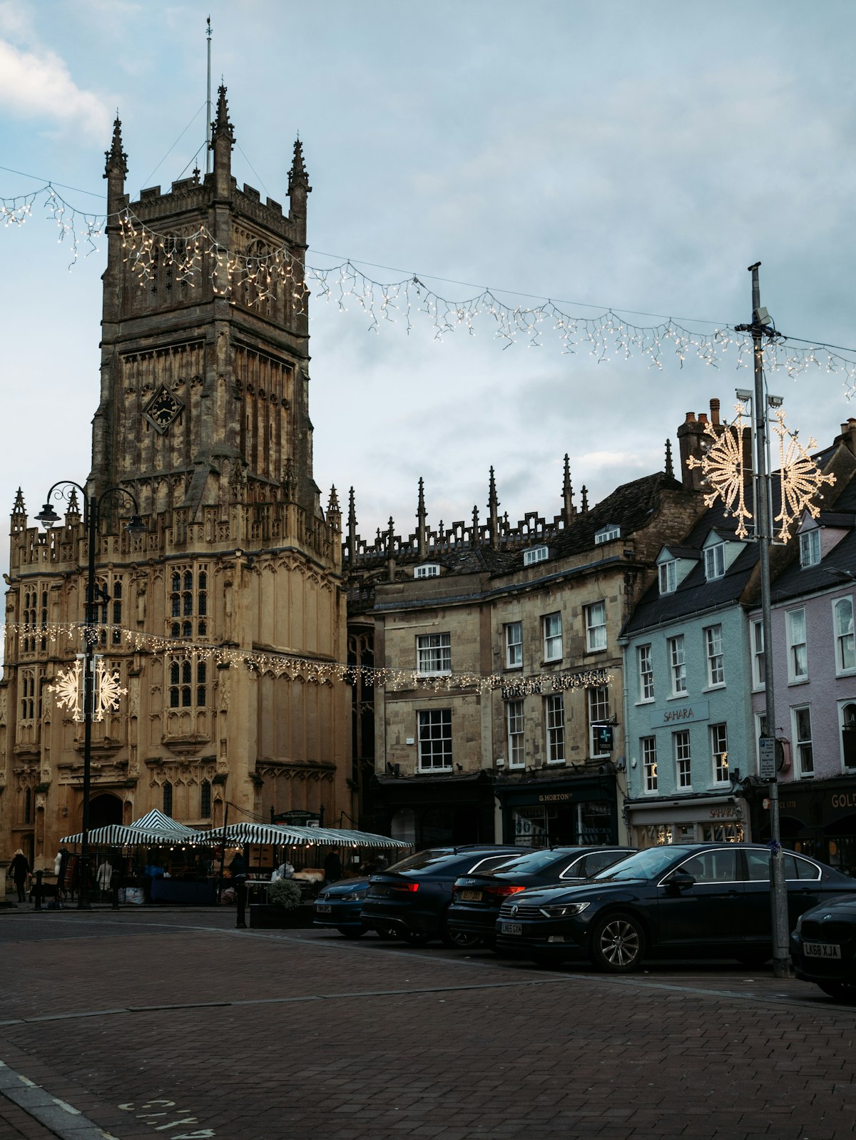 Honey-coloured stone buildings on a street in Cirencester, the largest town in the Cotswold District