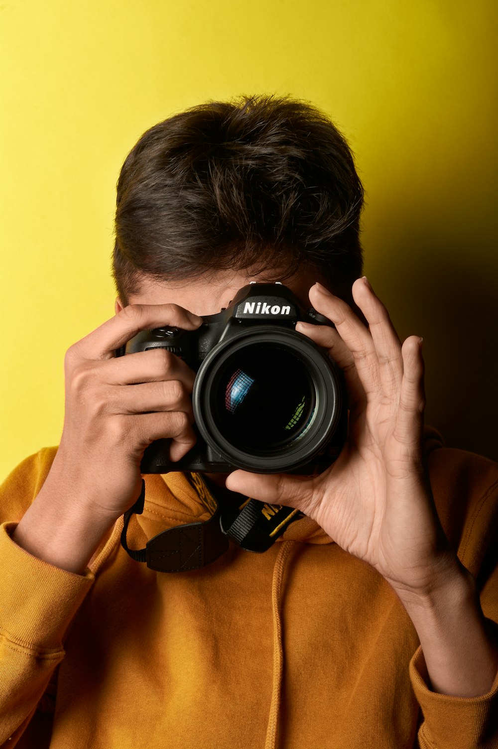 man using DSLR camera