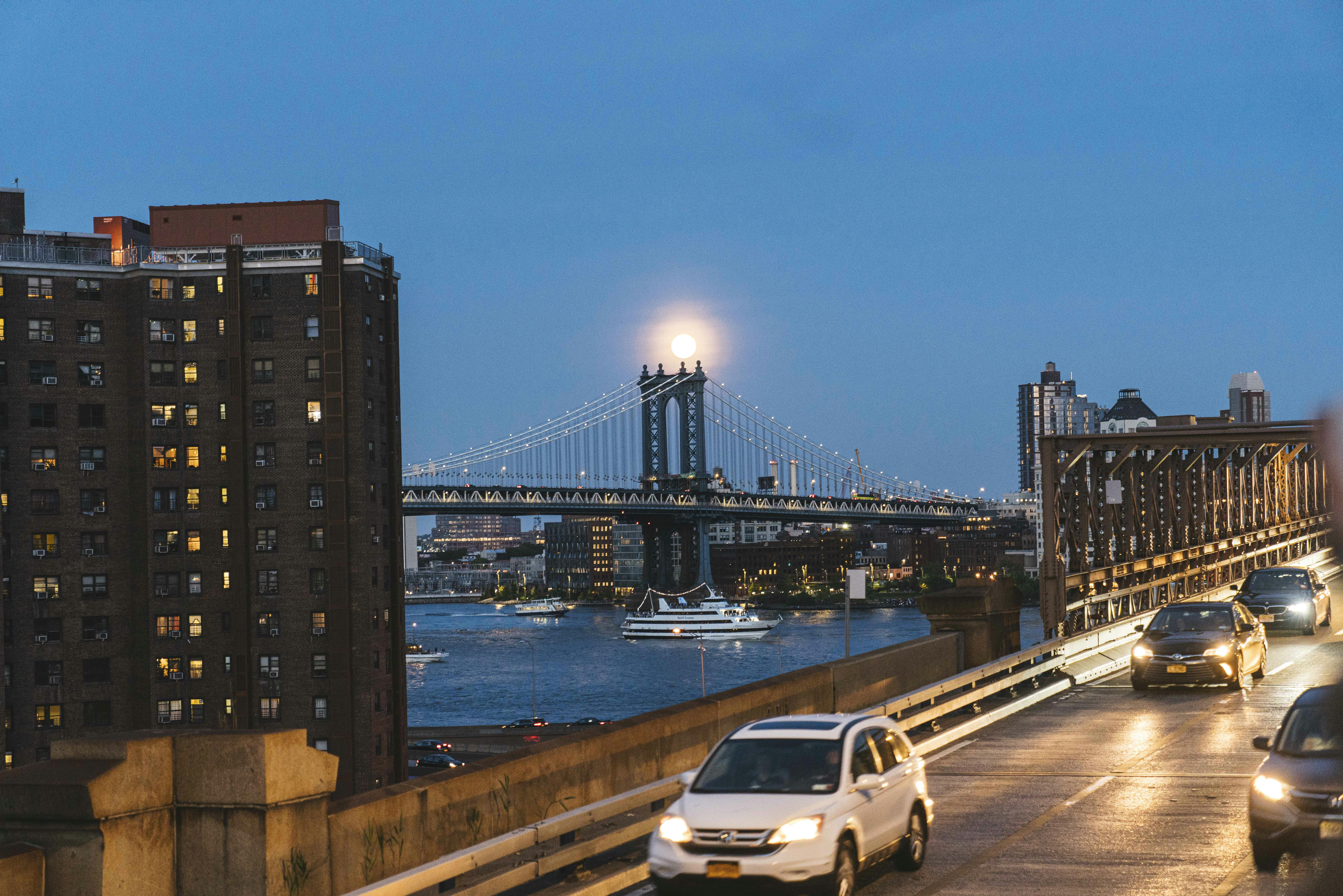 vehicles passing on bridge at night