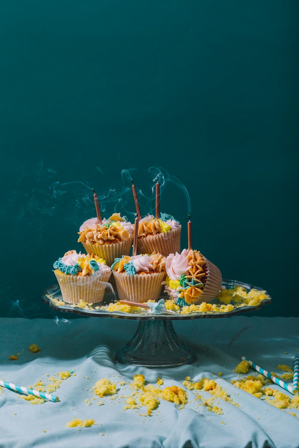 clear glass cake stand of cupcakes