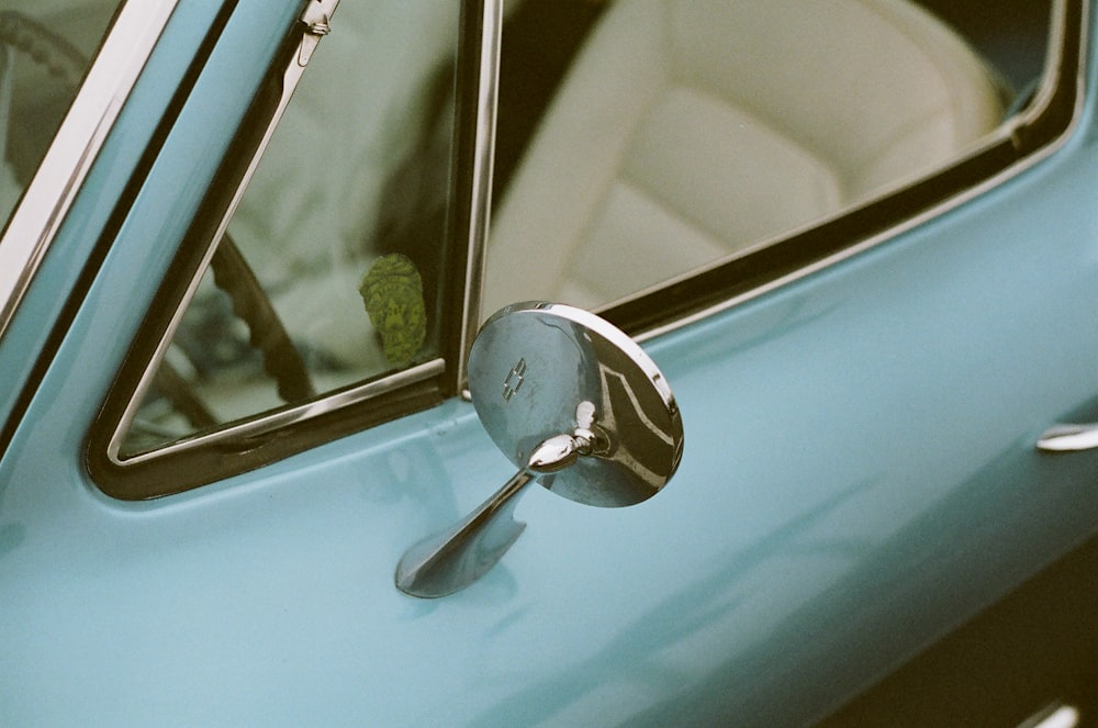 selective focus photography of parked gray vehicle