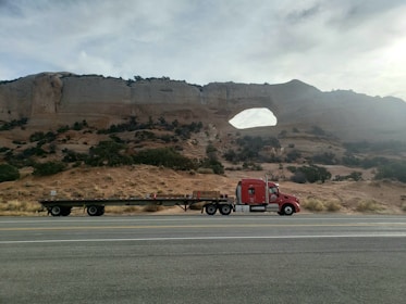 red semi trailer truck on road