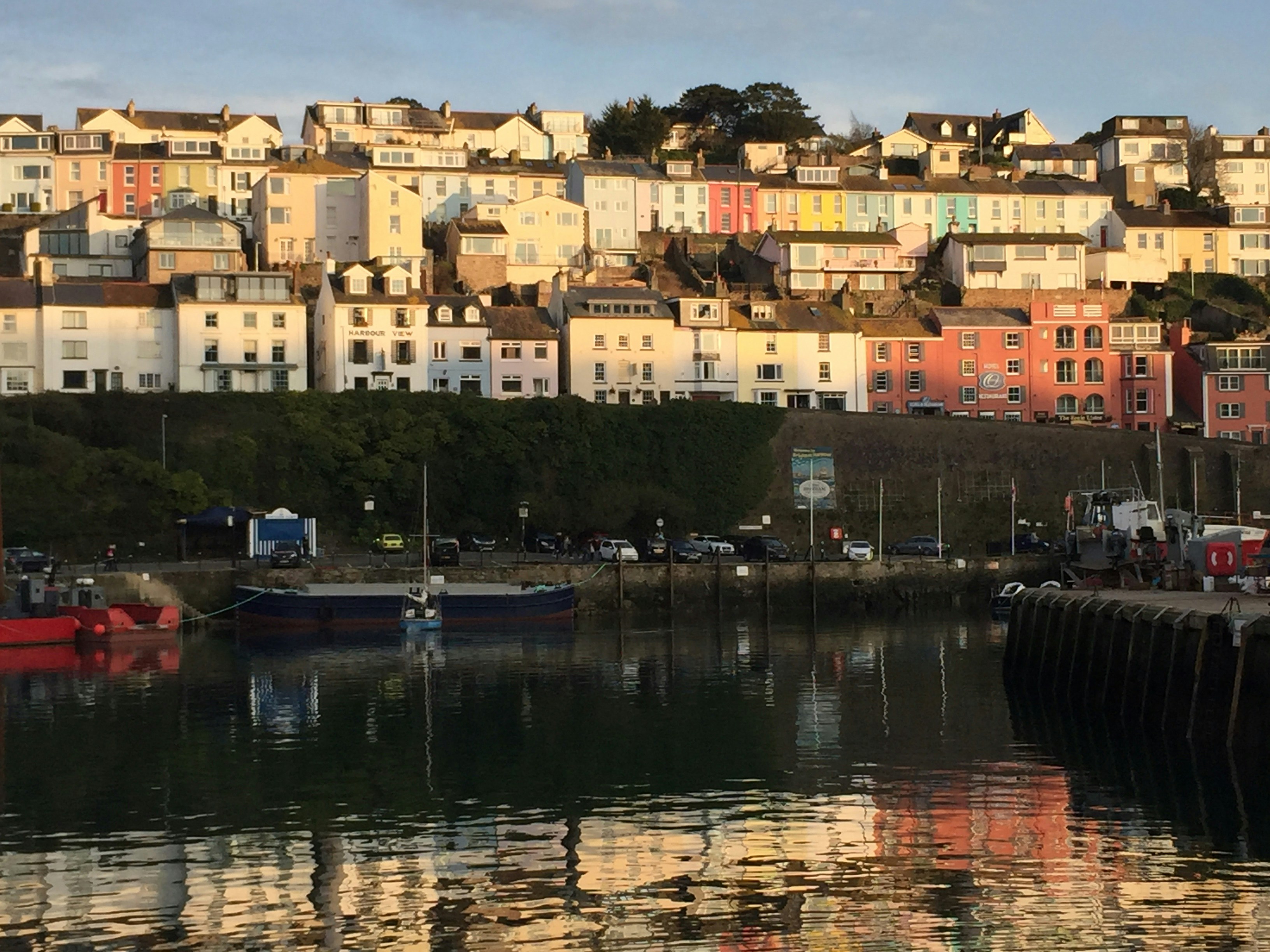 Colorful fishing boats at sunrise in Caribbean harbor
