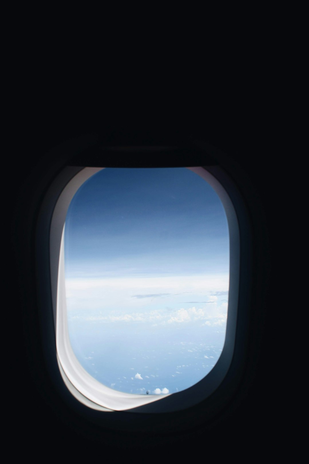 airplane window view of sky during day