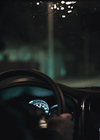 person driving car during night