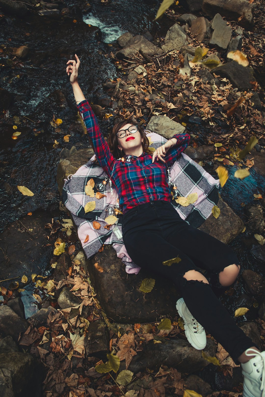 woman lying down on rocks