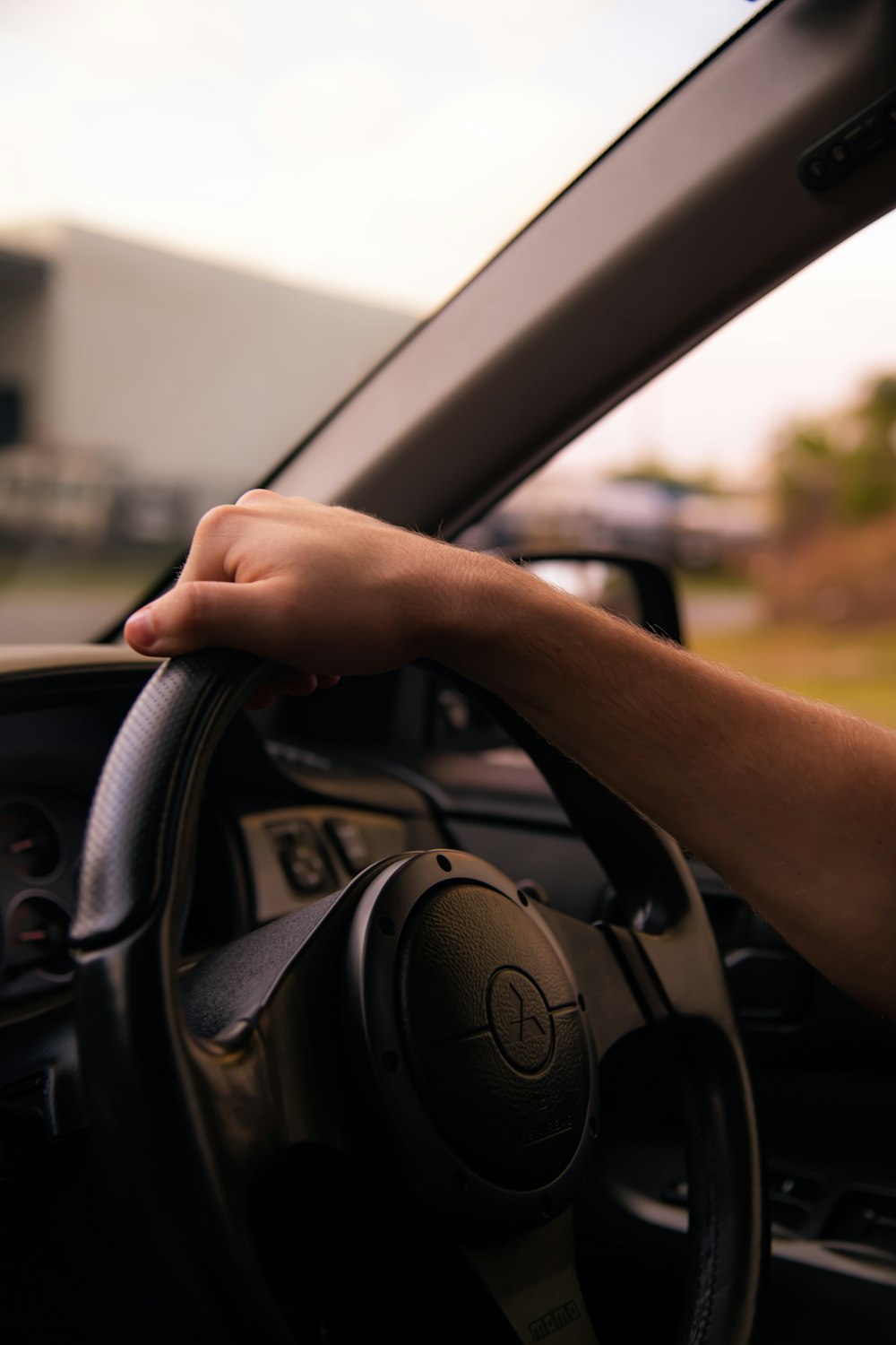 person driving black vehicle