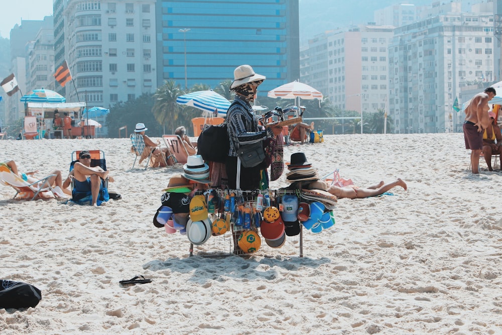 man carrying hats on rod