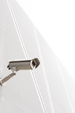a security camera attached to the side of a building