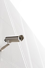 a security camera attached to the side of a building