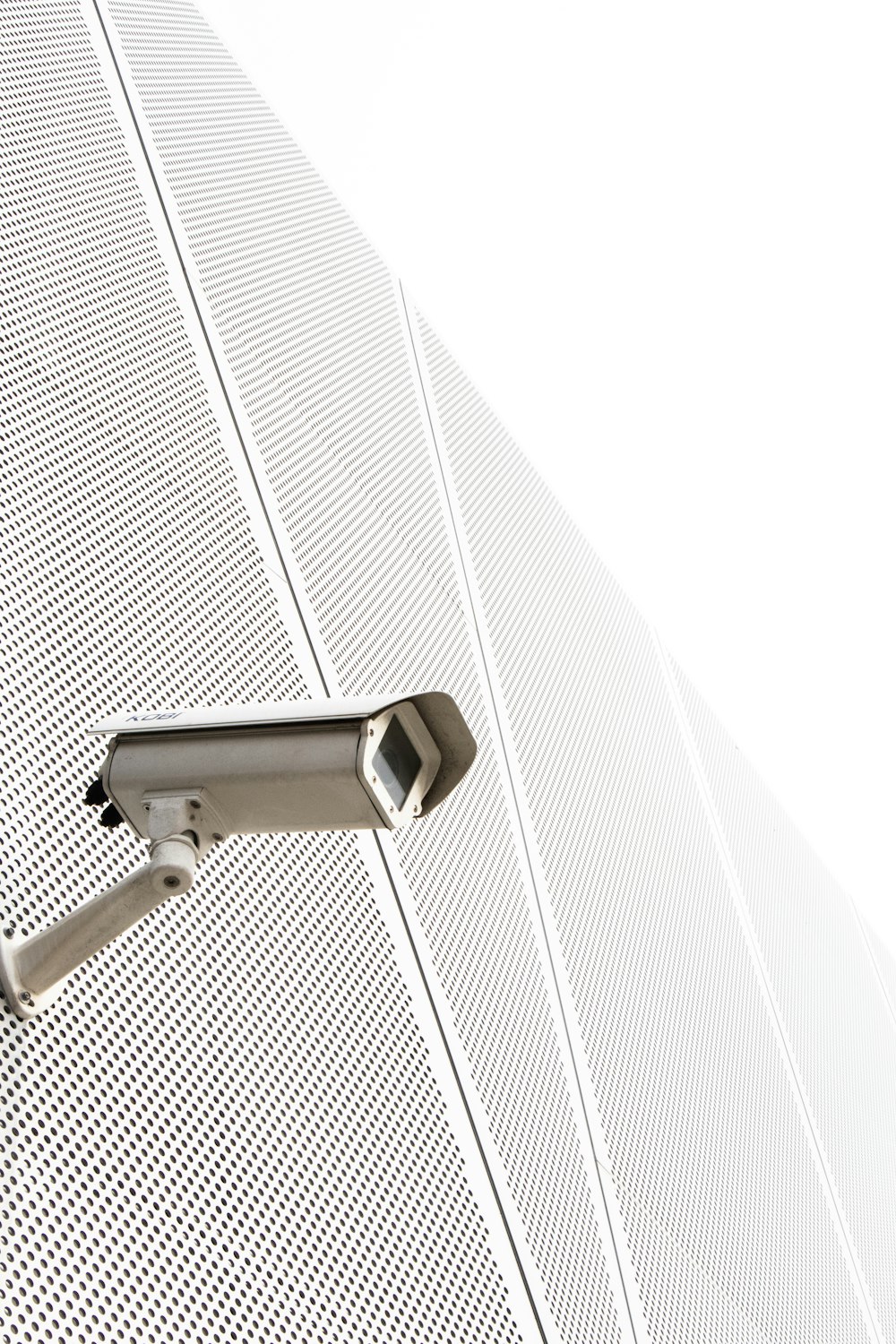 a security camera attached to the side of a building