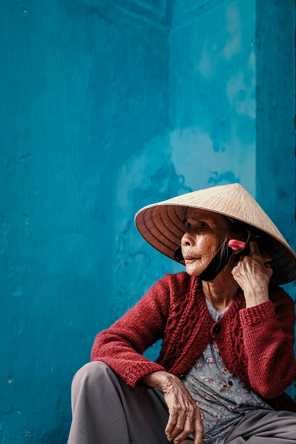 sitting woman wearing farm hat