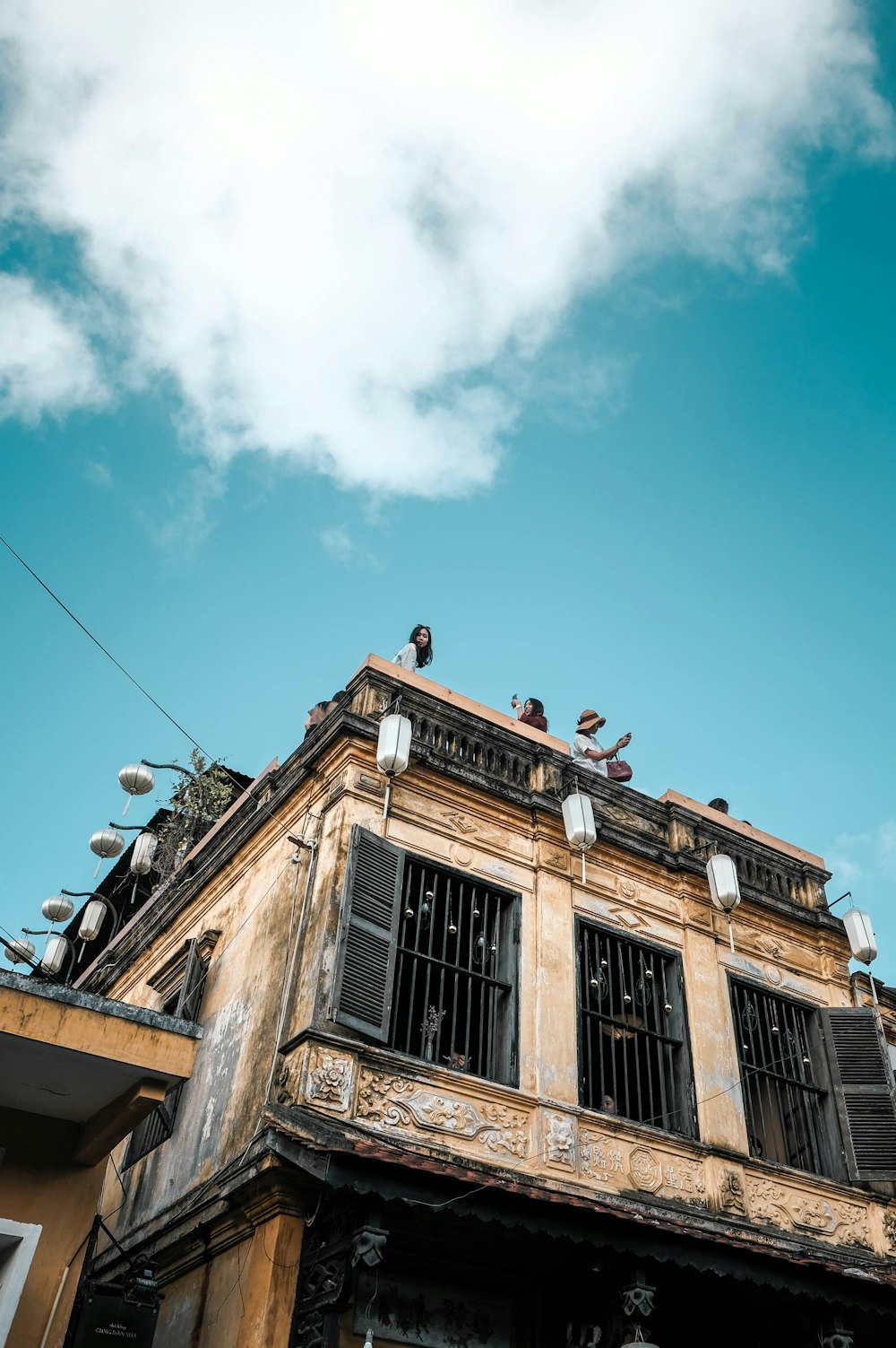 people at the roof of a building during day