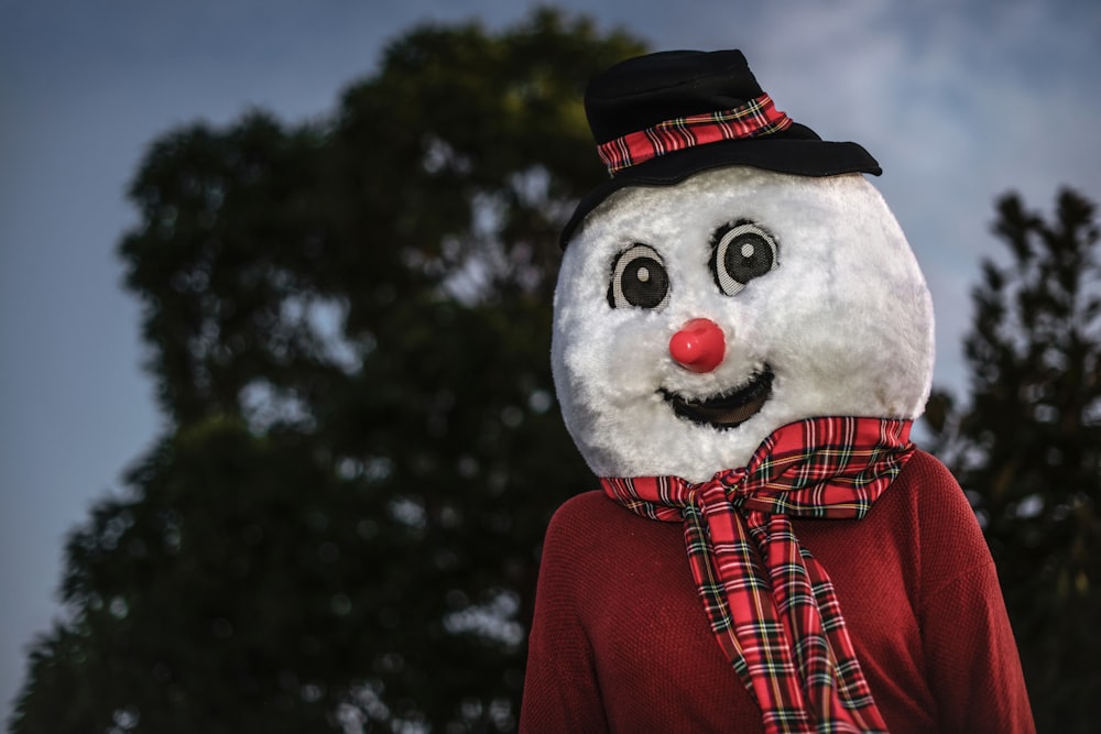 snowman decor near trees during night